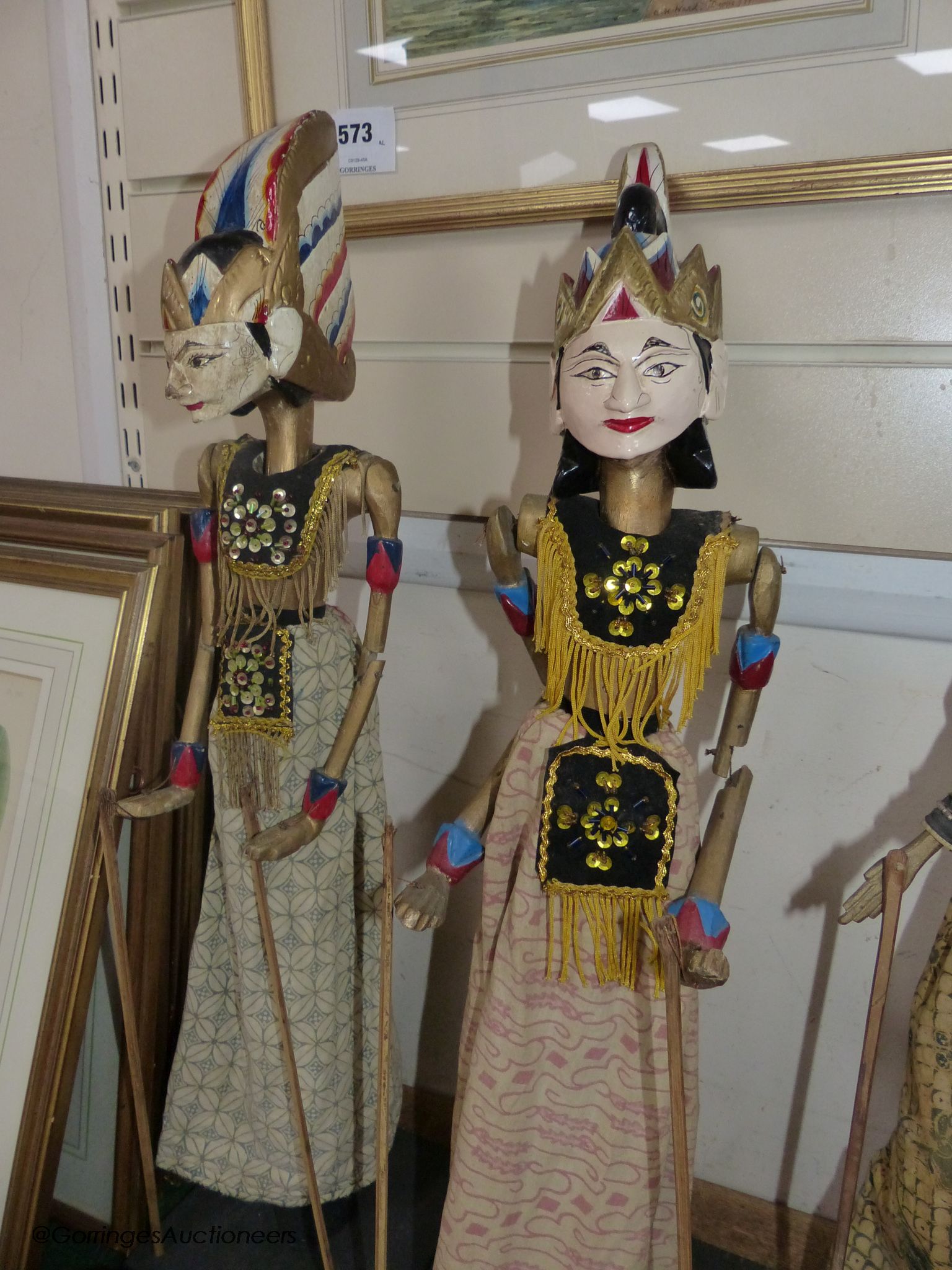 A collection of Indonesian stick puppets, tallest 76cm